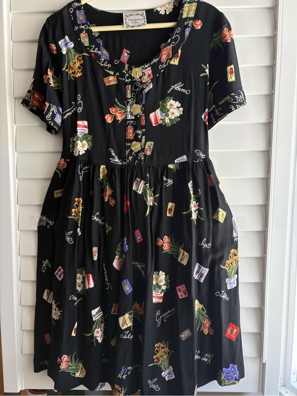 Clio Black Dress with Pink & Blue Floral Seed Packet Motif